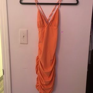 Neon orange, ruched mini tight dress.